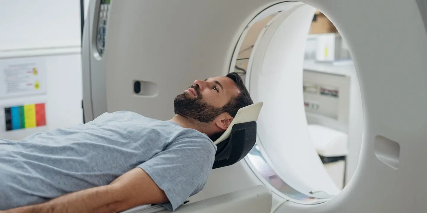 Patient Lying On The CT Scanner